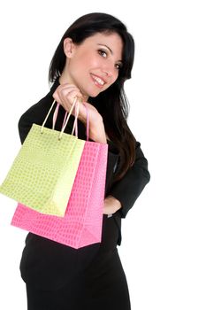 Female holding green and pink shopping bags.