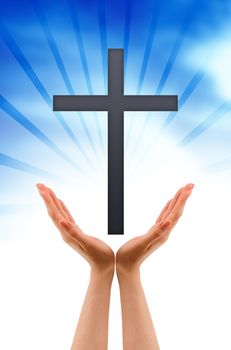 Hand holding a religious sign on cloud background.