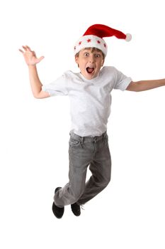 Excited crazy boy wearing a santa hat - motion in hand and feet.