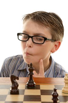 A young chess player considering or thinking carefully about his next tactical move