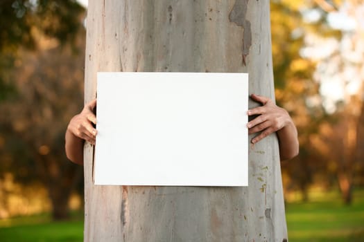 Environmentalist protester holding a blank sign ready for any message or statement