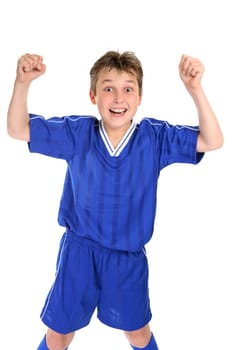 An elated boy celebrates with two fists in the air