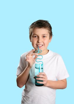 Boy holding a glass tumbler of water