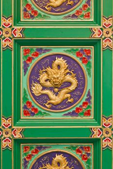 Decorative ceiling traditional chinese dragon image in chinese temple Thailand