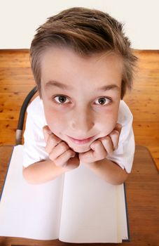 Comical geeky schoolboy with a book looking up.  Focus to face only.