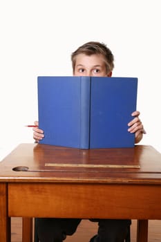 A child sitting down reading a book