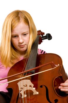 Young girl playing cello isolated on a white background