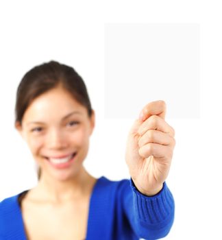 Attractive young woman showing a business blank card. Isolated on white background.