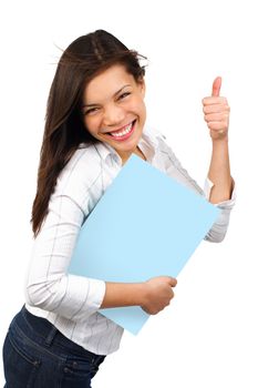 a young excited  woman holding a sign and doing a thumbs up. Isolated on white background