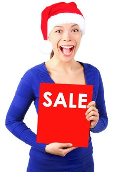Excited christmas woman with santa hat holding red sale sign. Isolated on white background.