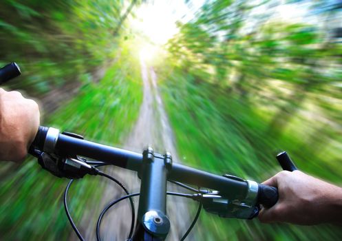 Mountain bike speed zoom motion blur. Fast downhill biking. 