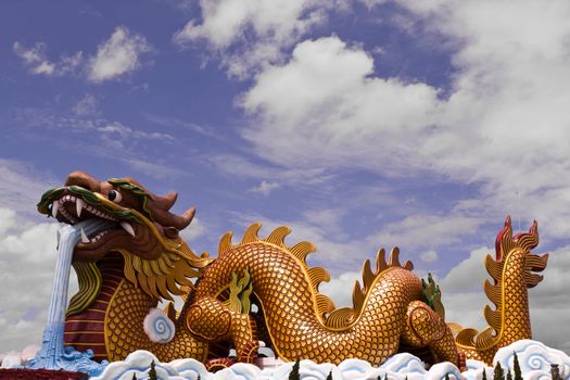 Big dragon statue and blue sky with cloud in Thailand