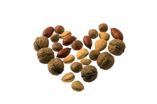 A heart of various nuts isolated on white background