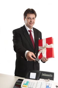 A man pays for a present with card at the checkout.