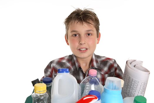 Boy holding a selection of recycling objects.