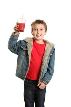 A boy dressed in casual clothes holds a fresh berry juice.