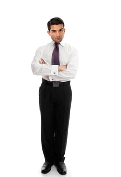 Confident business man or salesman standing with arms folded on a white background.