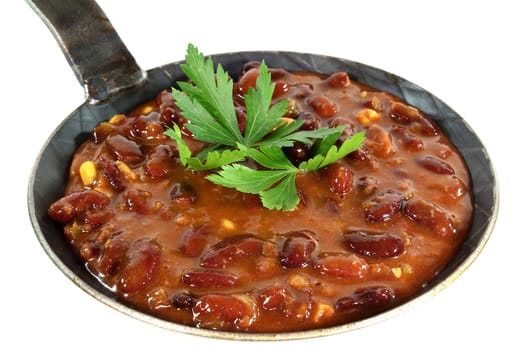 a pan with chilli con carne and parsley