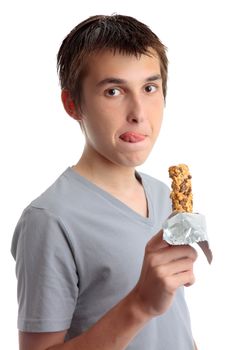 Nutrition.  A boy enjoys a delicious healthy muesli snack bar