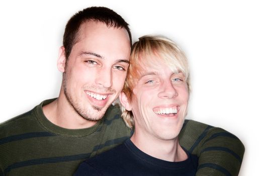 Two handsome men posing for portrait on white background