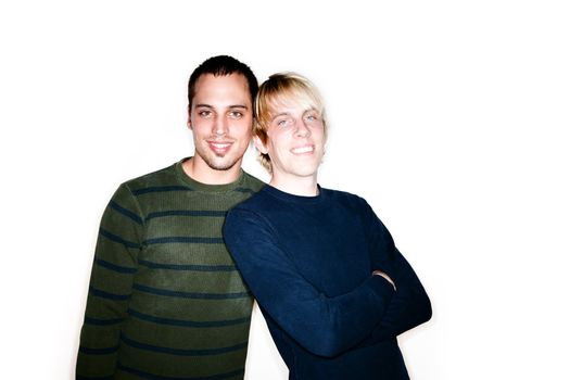 Two handsome men posing for portrait on white background