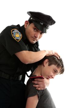 A policeman apprehends a male teen thief.  White background.