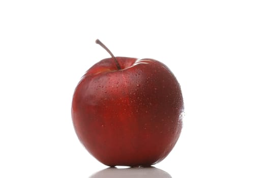 A red apple with waterdrops isolated on white background