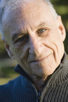 Portrait of a Senior Man Smiling Directly To Camera