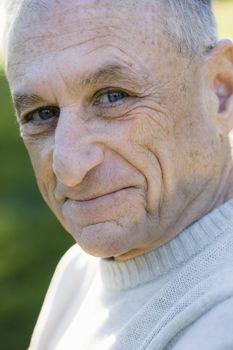 Portrait of a Happy Senior Man Looking Directly to Camera