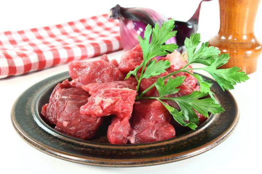 a plate of fresh raw beef goulash