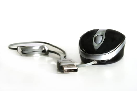 Computer mouse with cable on white background