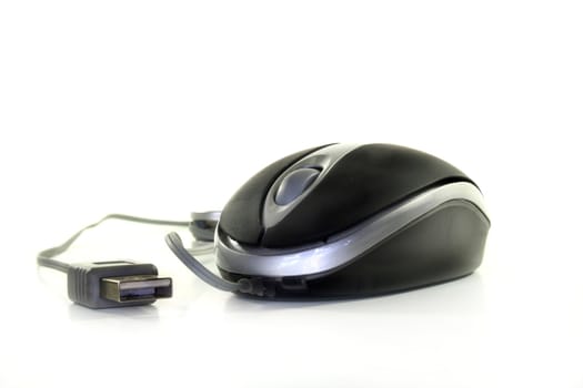 Computer mouse with cable on white background