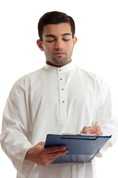 A traditional dressed arab or middle eastern south asian businessman or salesman writing in a blue clipboard folder.