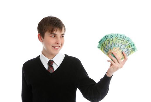 Teen boy or student holding a fan of money in one hand and smiling.   NB: Cash money - showing one sided only permitted (http://www.secretservice.gov/money_illustrations.shtml)