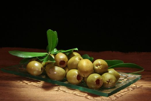 pickled green olives with olive branch