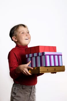 Boy holding lots of gifts