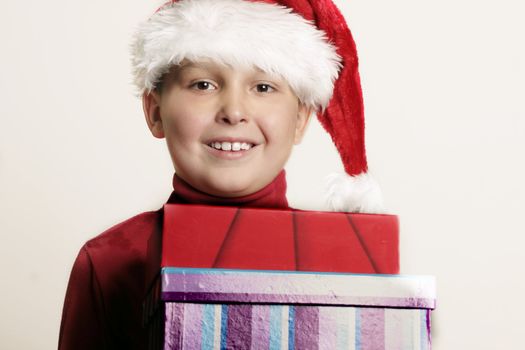 Child holding christmas gifts