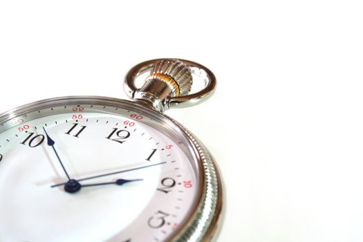 pocket watch lying on a white background