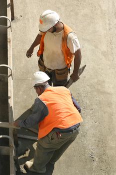 Two men laying formwork