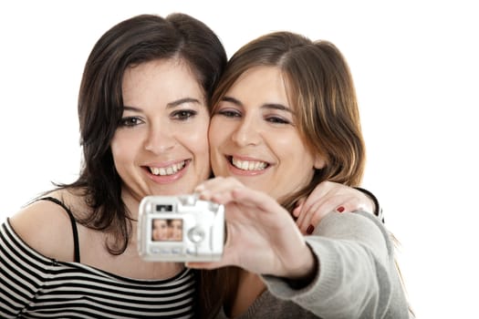 Two beautiful young woman taking self portraits
