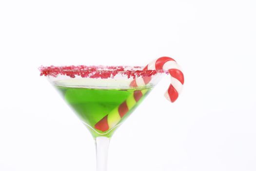 Green alcoholic drink edged in red with a candy cane decoration.
Christmas drinks, work party, celebrations, etc.