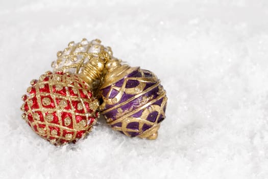 Three Christmas decorations on snow
(fake snow)
