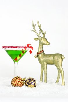 A christmas drink, with red and purple baubles and golden reindeer decorations on snow.

Merry Christmas