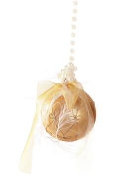 Gold glass bauble decorated and tied with ribbons and pearls