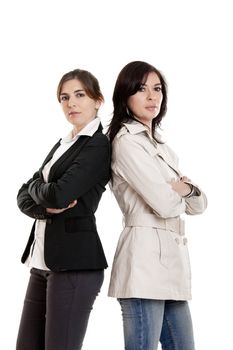 Two young modern women standing over a white background