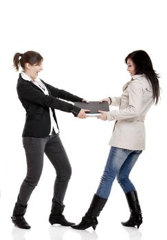Two young women Fighting for a laptop, isolated on white