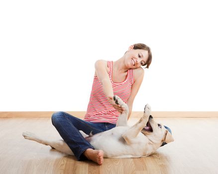 Beautiful young girl playing with a nice cute dog