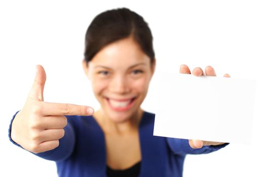 Pointing at blank paper card. very happy excited woman pointing at empty white paper. Isolated on white background.