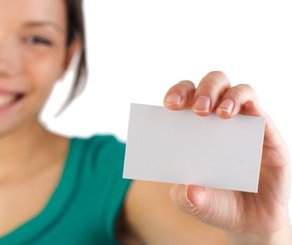 Business card. Beautiful young woman with big smile displaying a blank business card. Shallow depth of field, focus on card. Isolated on white background