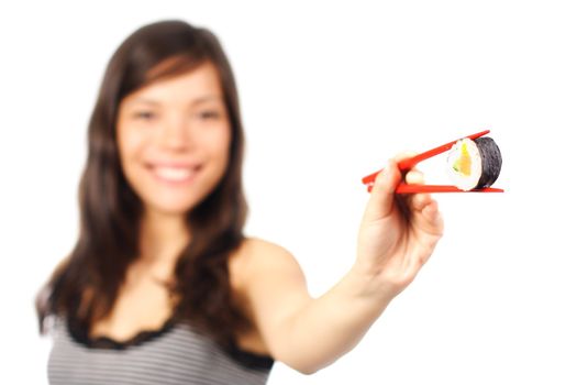 Sushi. Woman giving a salmon maki sushi. Beautiful smiling model. Shallow depth of field, focus on sushi. Isolated on white background.